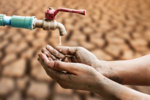 hand waiting for water from faucet