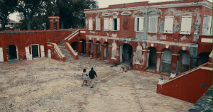 Rennisha walks by a building