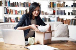 woman packing a shipment