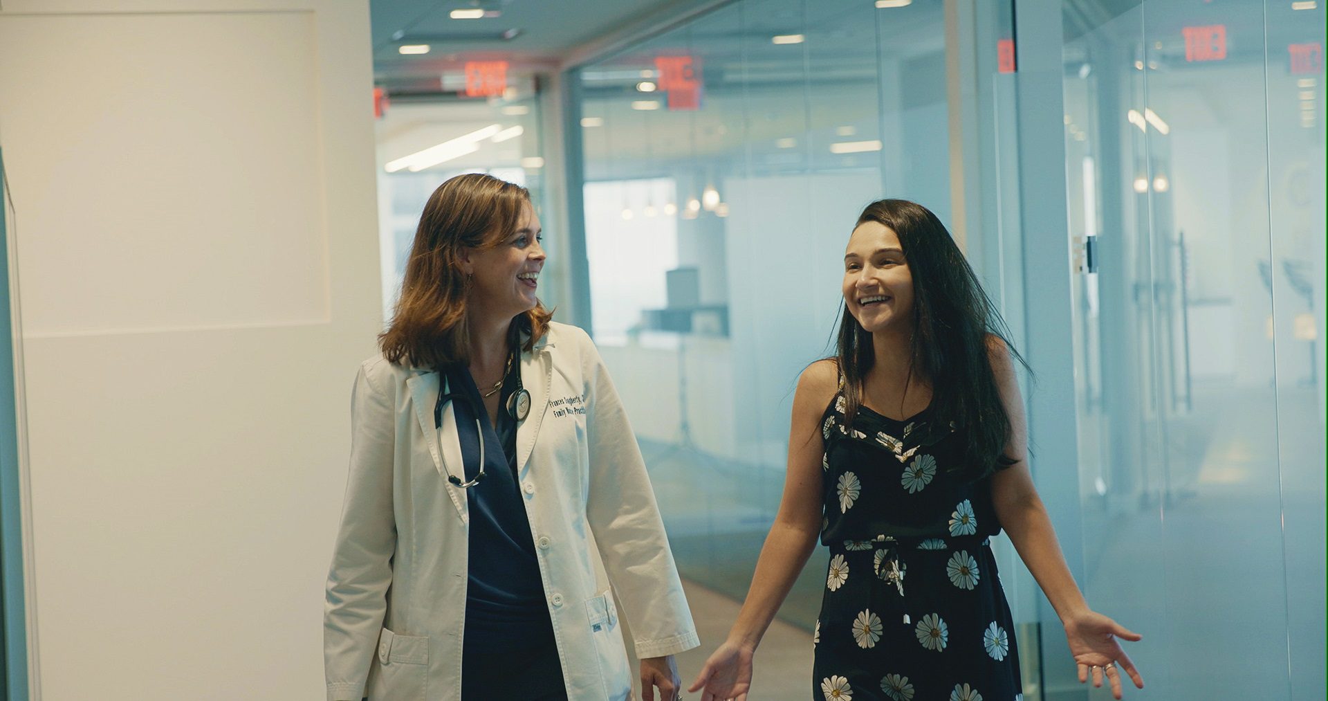 Nurse walking with patient.