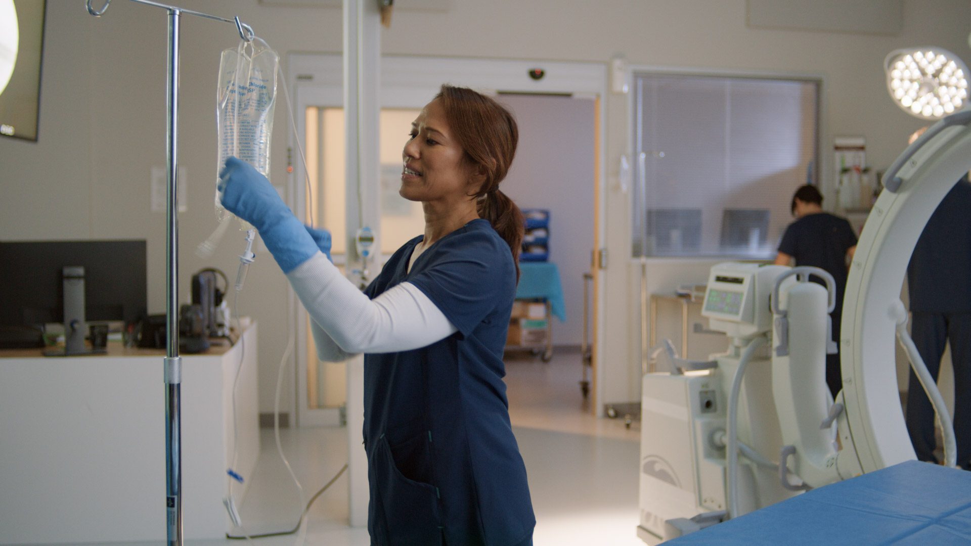 Nurse changing IV