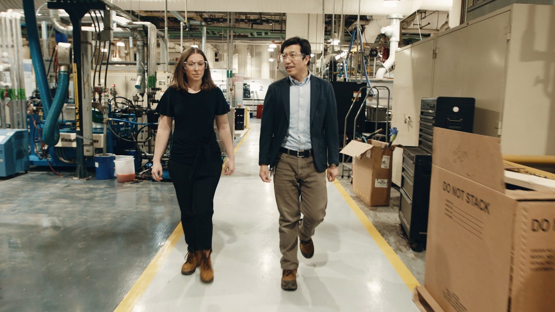 Staci walking in BASF factory.