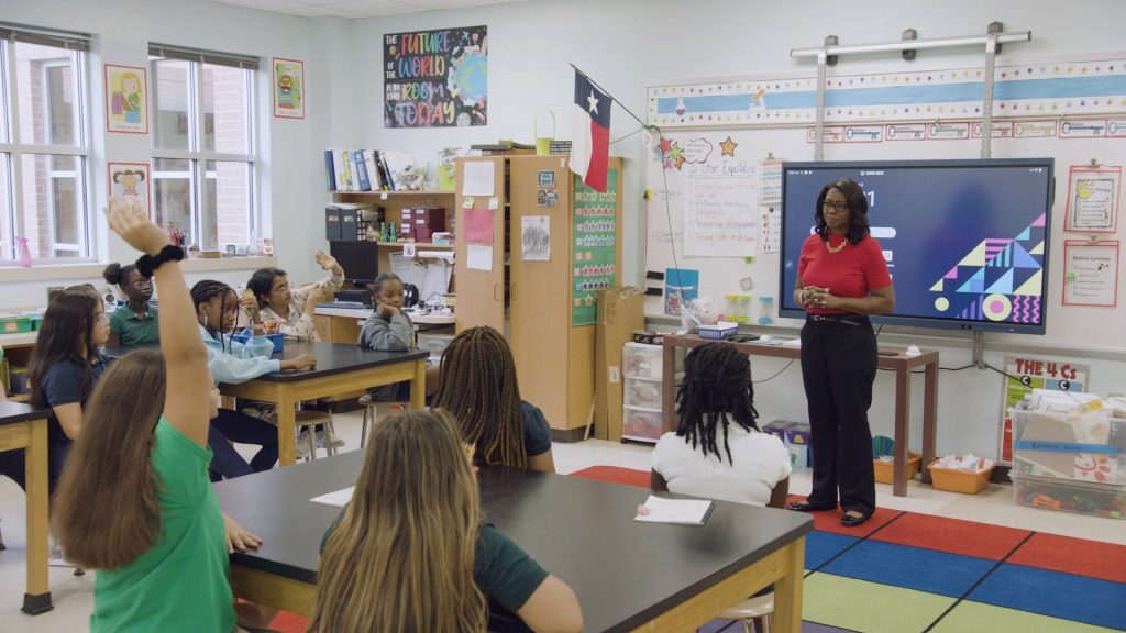 Michelle Exxon Change Maker in classroom educating kids about recycling