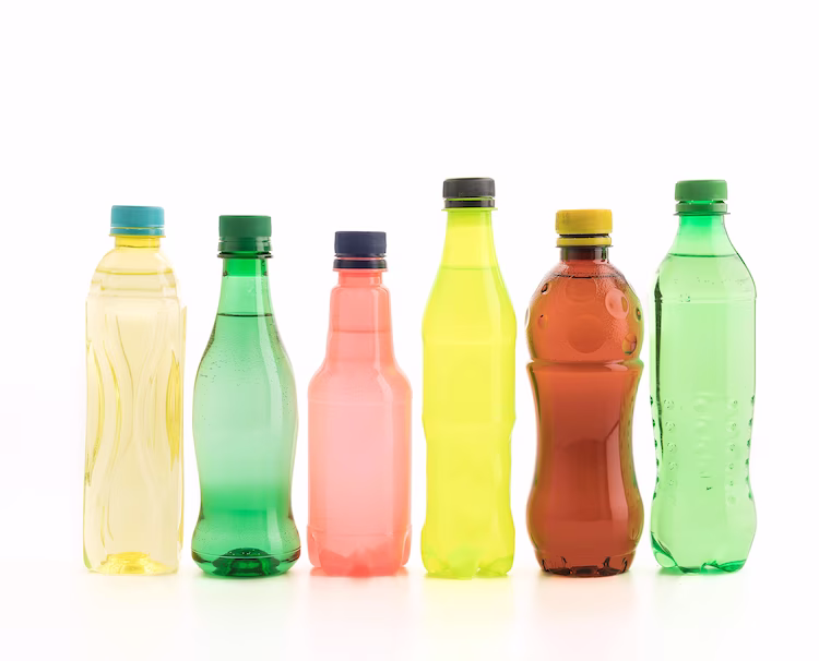 A lineup of plastic bottles featuring a variety of shapes and colors.