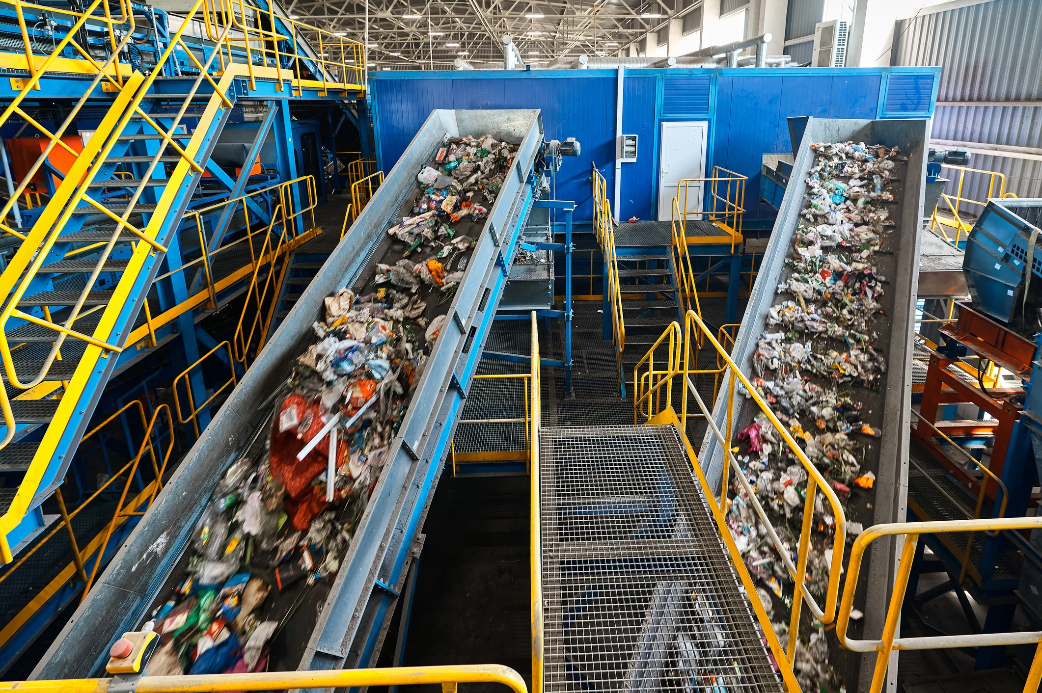 Trash transported to sort by conveyor in recycling plant