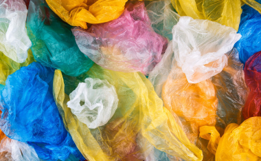 Multicolored plastic bags texture background. Polyethylene environmental pollution concept.